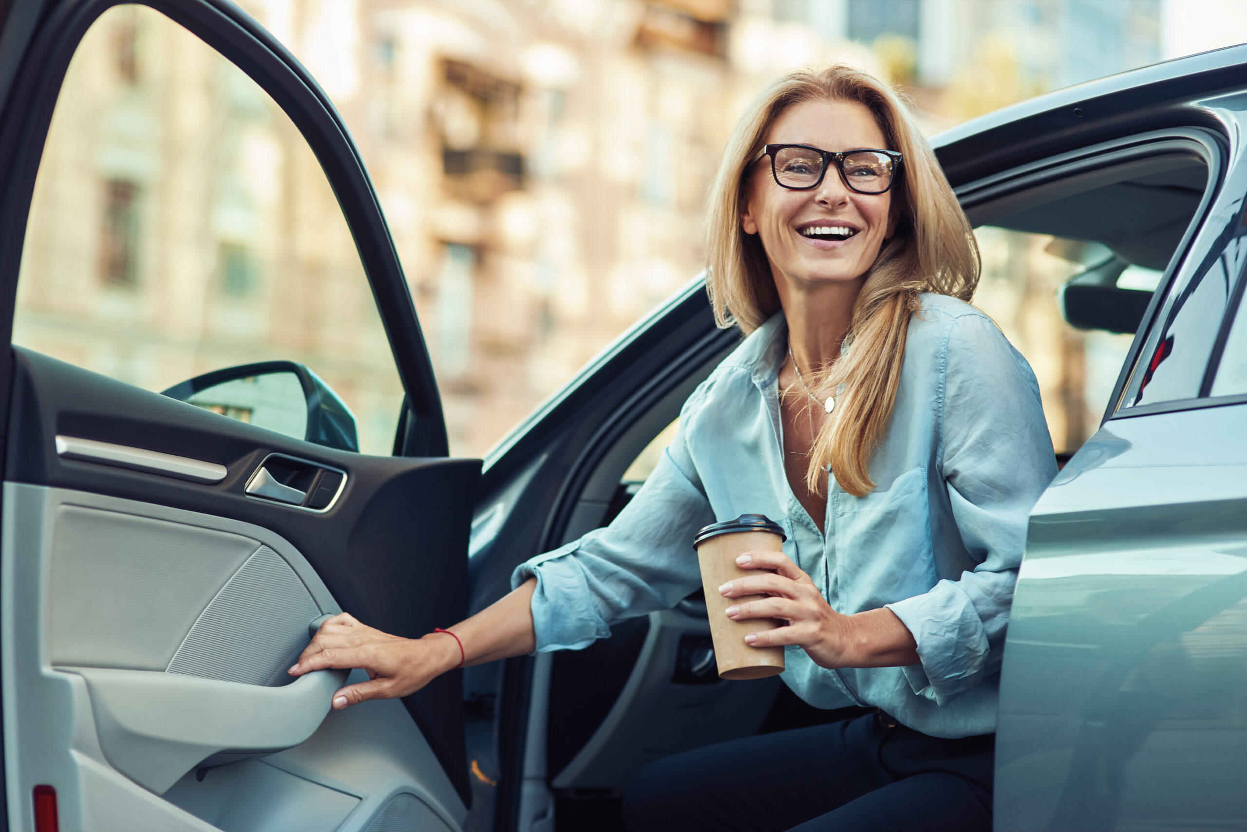 Happy,Attractive,Woman,Or,Business,Lady,Wearing,Eyeglasses,Holding,Cup